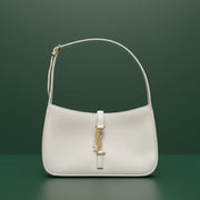 Saint Laurent Le 5 à 7 hobo shoulder bag in smooth leather with gold-tone YSL monogram and adjustable strap