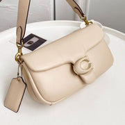 Coach Pillow Tabby shoulder bag in ivory padded leather with gold-tone C closure and adjustable strap