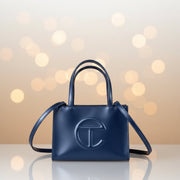 Telfar Small Shopping Bag in cobalt blue vegan leather with embossed logo, front view